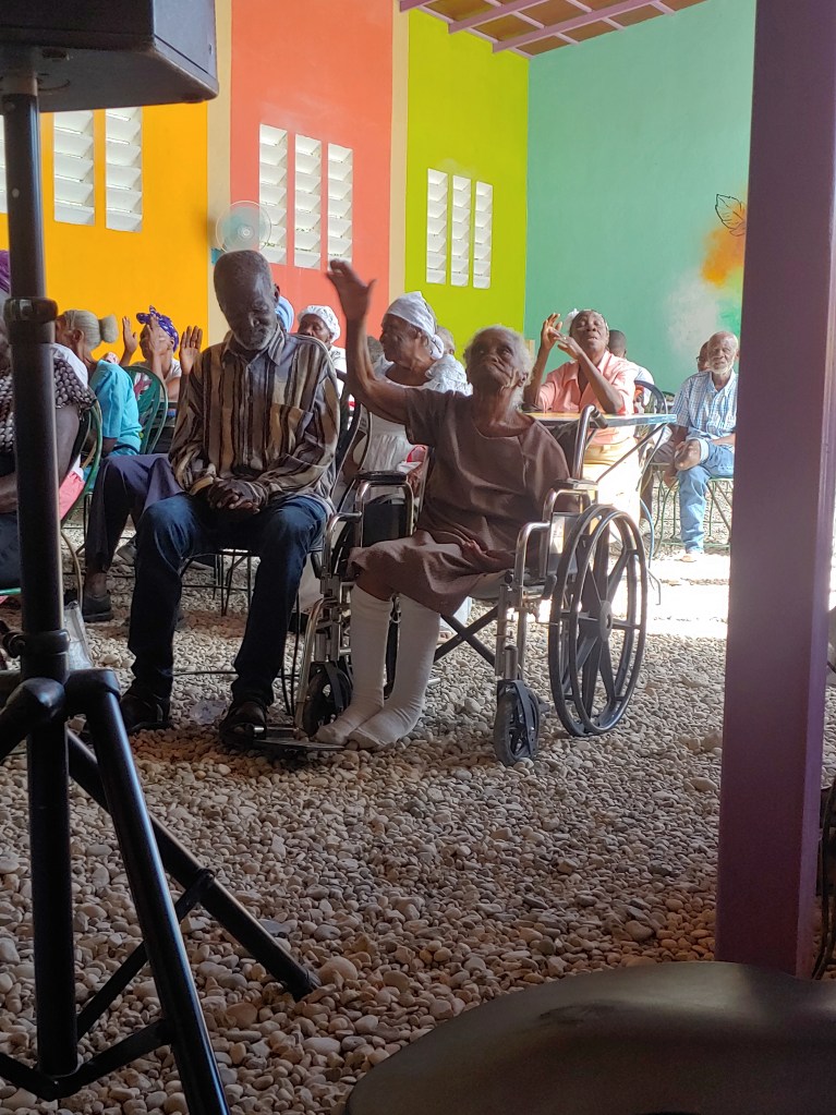 A beautiful moment... One of our elders raising her hand in worship.